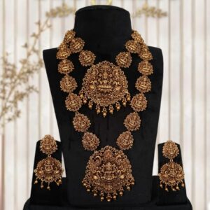 "Discover exquisite South Indian temple antique bridal jewellery featuring handcrafted necklace, majestic haram, elegant earrings, traditional tikka, and ornate hip chain. Perfect for brides seeking timeless heritage designs with intricate craftsmanship and divine temple motifs. Elevate your wedding look with authentic antique jewellery that blends tradition and luxury."