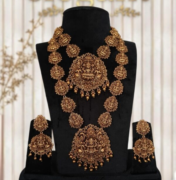 "Discover exquisite South Indian temple antique bridal jewellery featuring handcrafted necklace, majestic haram, elegant earrings, traditional tikka, and ornate hip chain. Perfect for brides seeking timeless heritage designs with intricate craftsmanship and divine temple motifs. Elevate your wedding look with authentic antique jewellery that blends tradition and luxury."